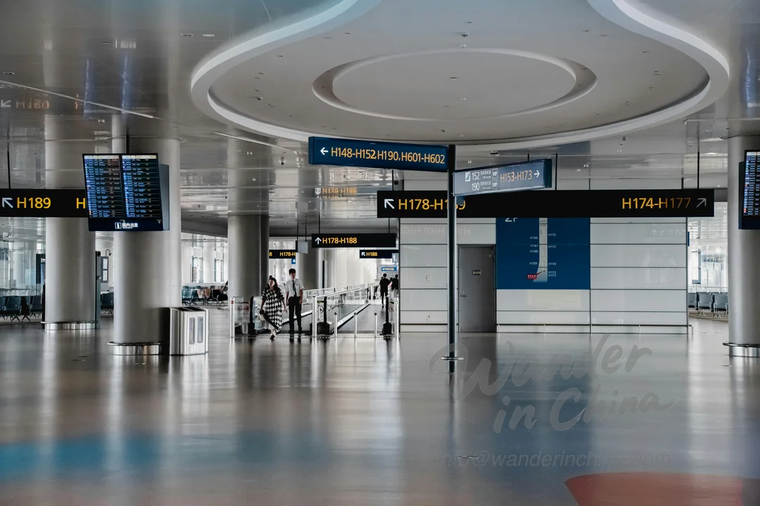 Busy airport terminal in China showing travelers on a layover.