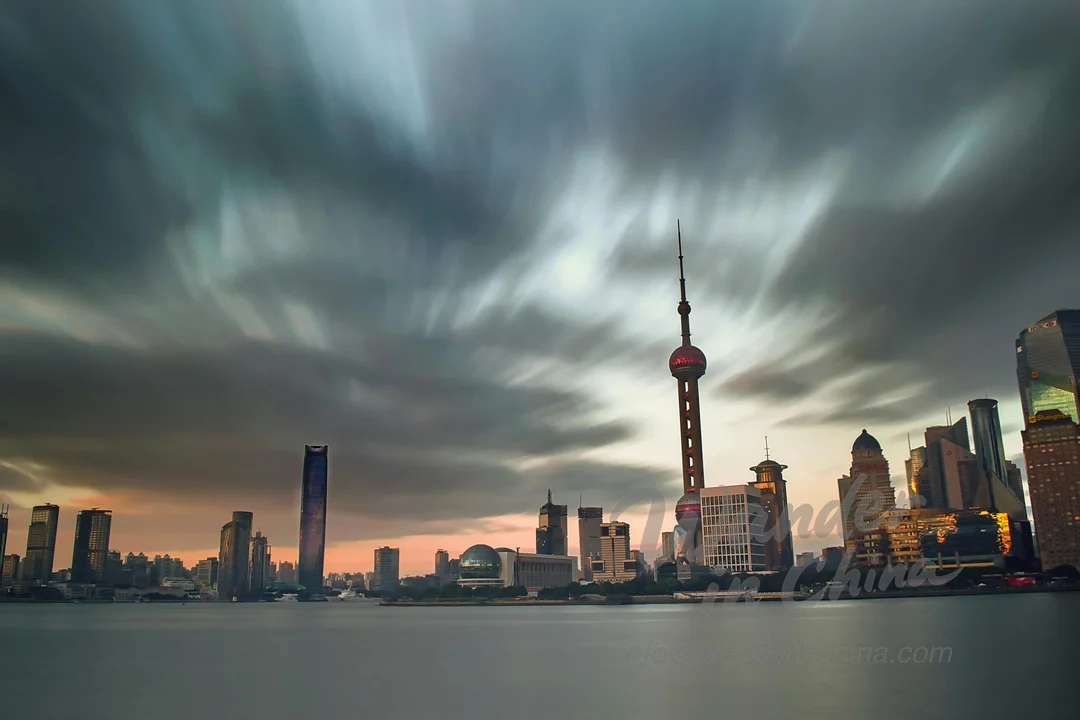 Shanghai skyline at dusk with Oriental Pearl Tower.