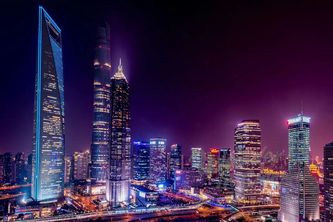 Shanghai skyline at night from Huangpu River cruise.
