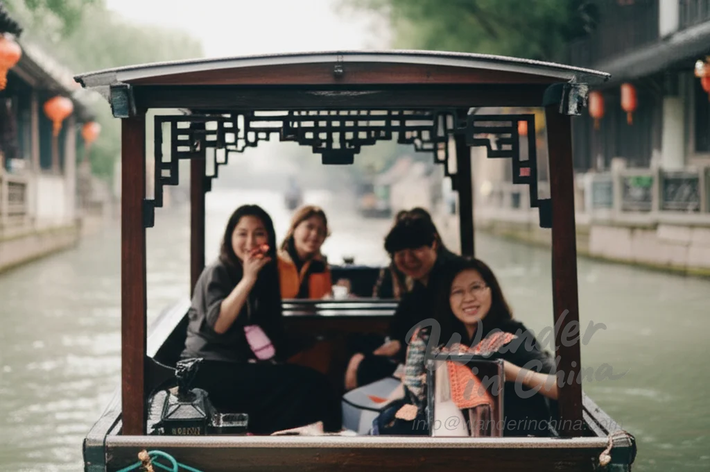 Tourists enjoying a boat ride on the canals of Zhujiajiao.