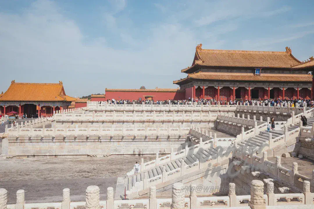 Foreign tourist admiring the Hall of Supreme Harmony in the Forbidden City.